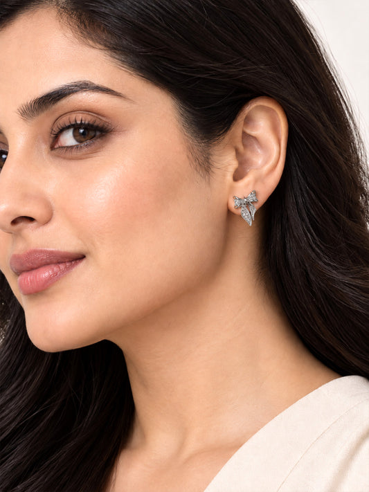 Clear Pave Bow Stud Earrings, silver plated, model close-up