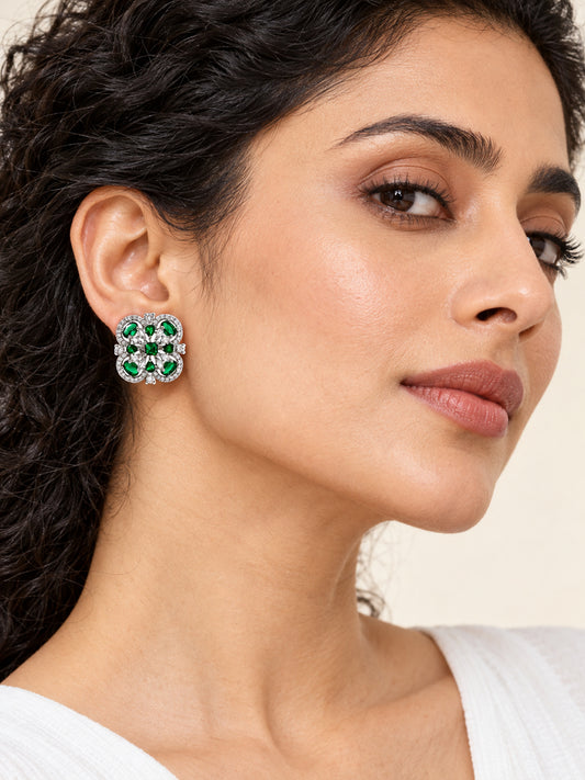 Green Scrollwork Floral Stud Earrings in silver plating worn by a model, close-up