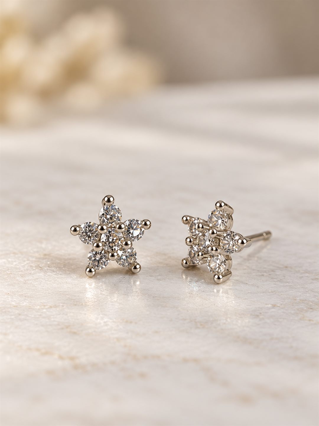 Clear Stone Star Flower Stud Earrings, silver plated, lifestyle view