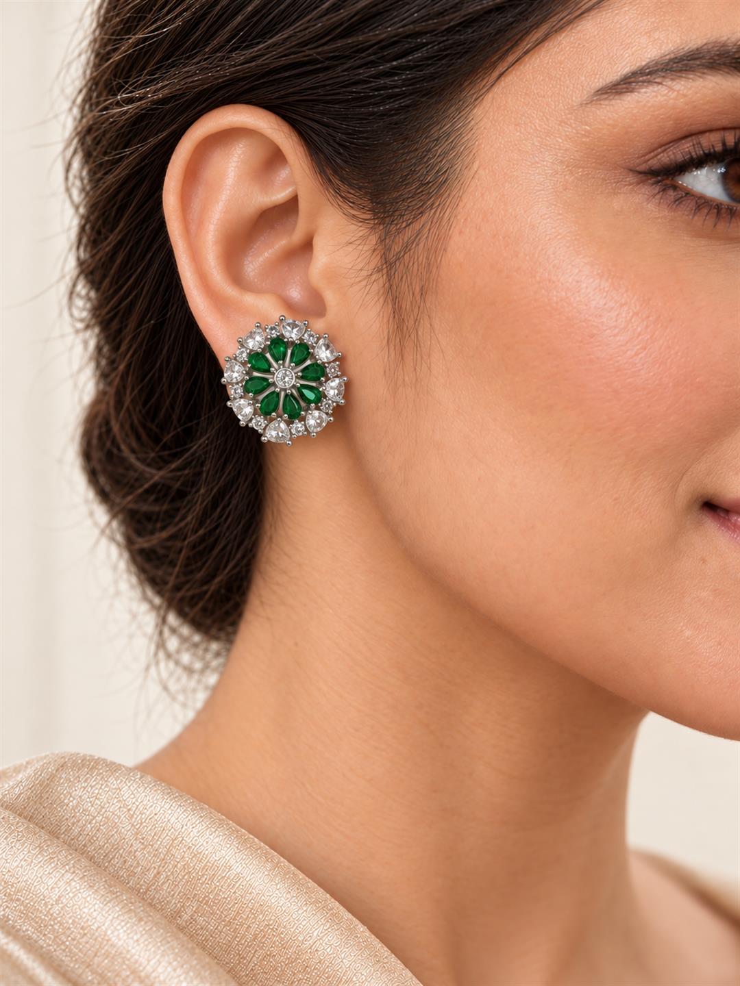 Green heart-petal flower silver-plated stud earrings worn by a model