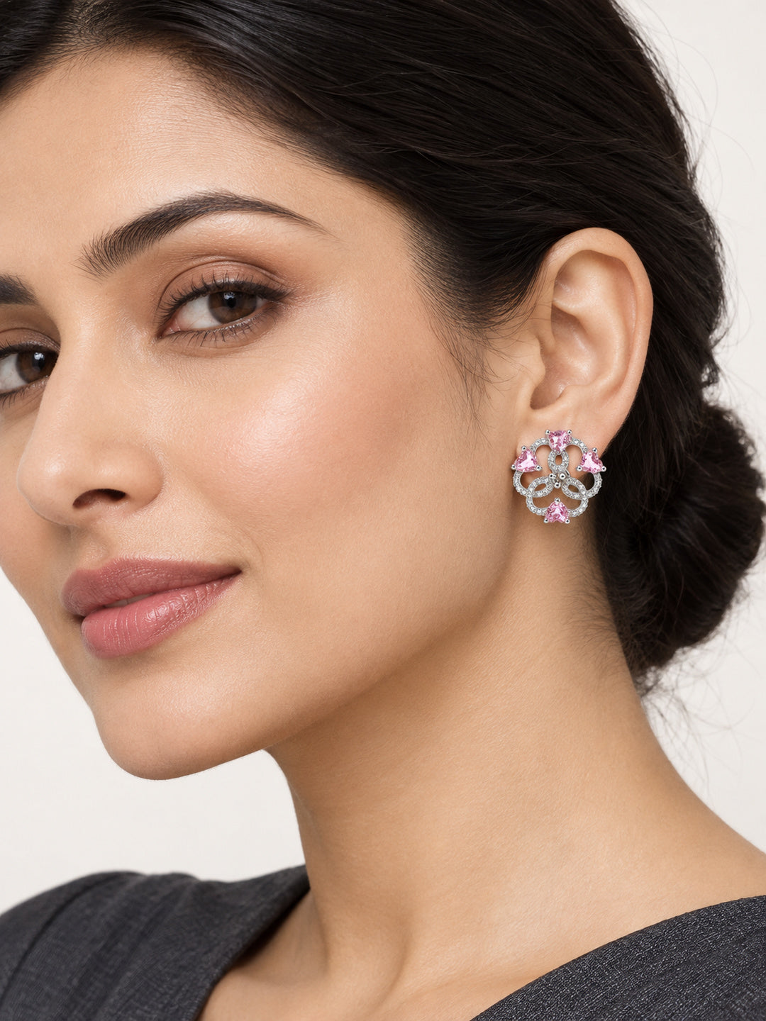 Pink Heart Stone Openwork Floral Stud Earrings in silver plating worn by a model, close-up