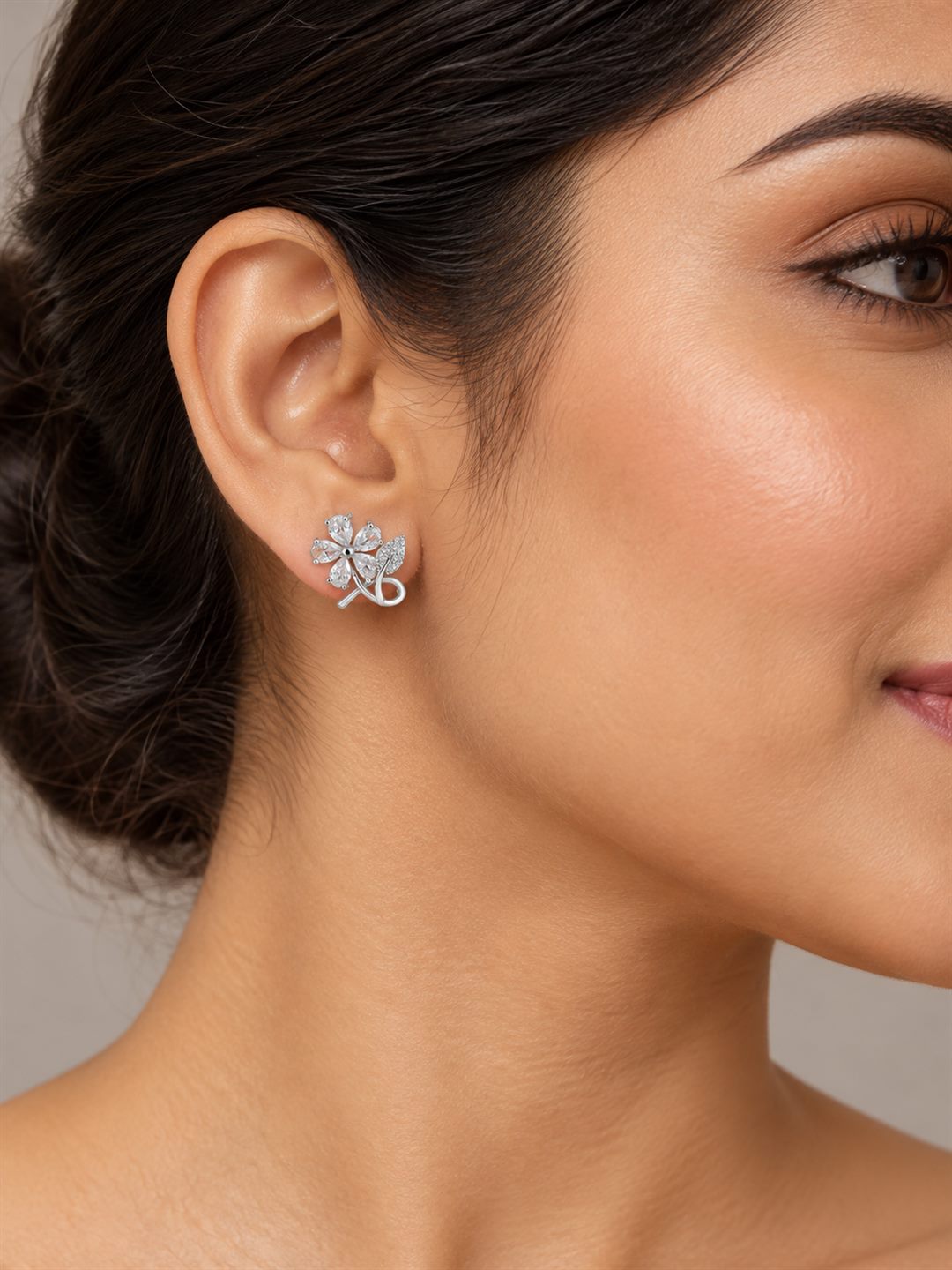 Clear Flower and Leaf Stud Earrings, silver plated, model close-up