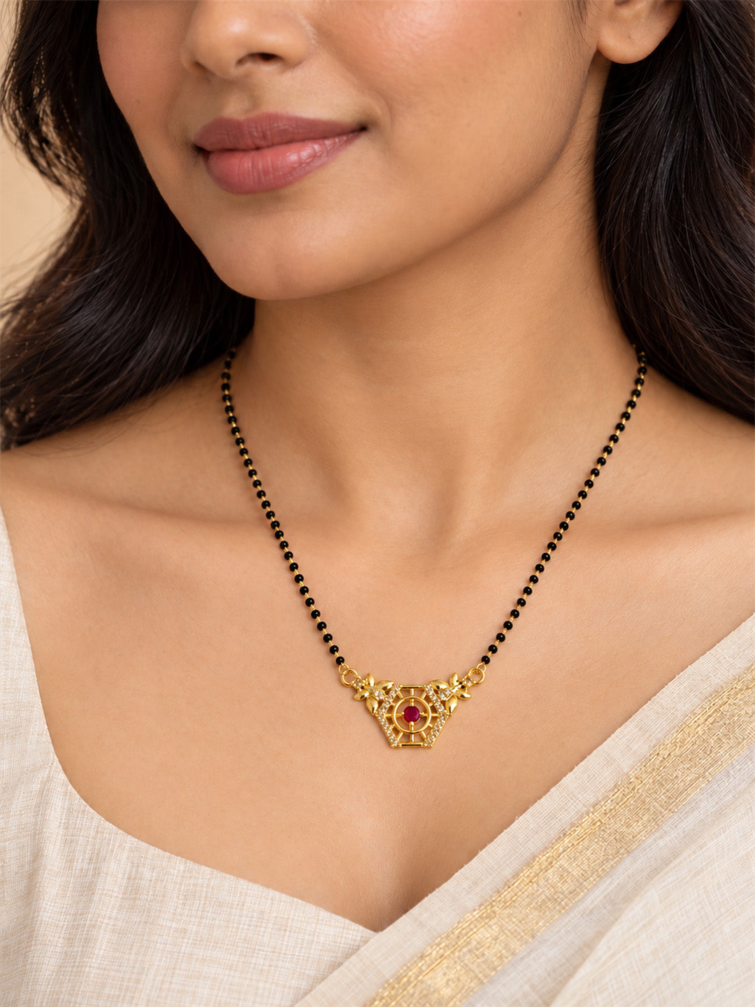 Red filigree triangle gold-plated mangalsutra worn by a model