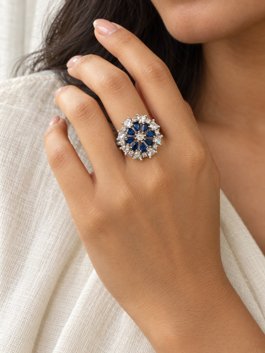 Blue Petal Halo Flower Ring - Silver Plated worn on hand - close-up
