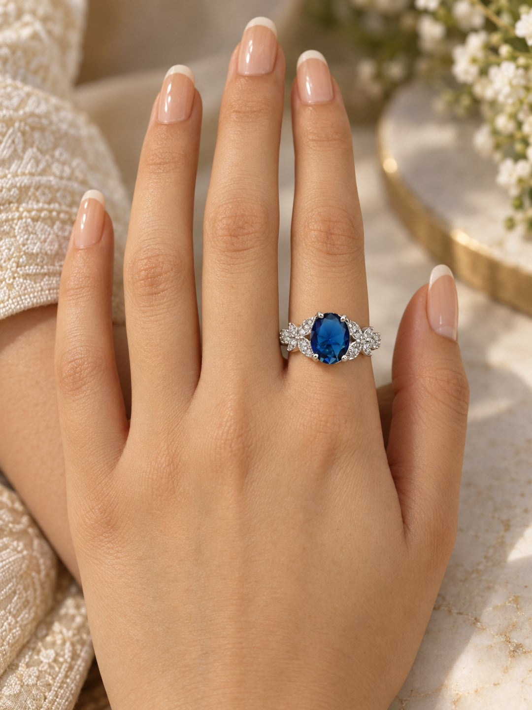 Blue Oval Center Stone Floral Shoulder Ring - Silver Plated worn on hand