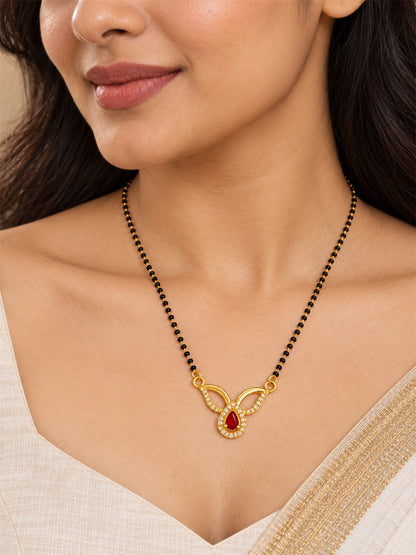 Red teardrop and open leaf gold-plated mangalsutra worn by a model