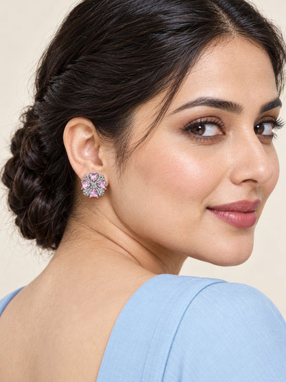 Pink Heart Stone Floral Stud Earrings in silver plating worn by a model, close-up