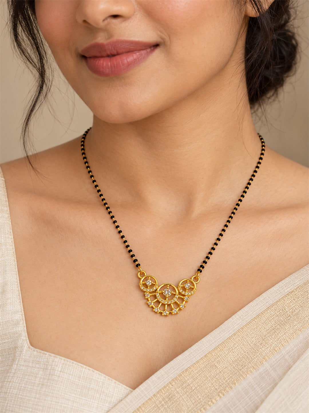 White scalloped floral gold-plated mangalsutra worn by a model