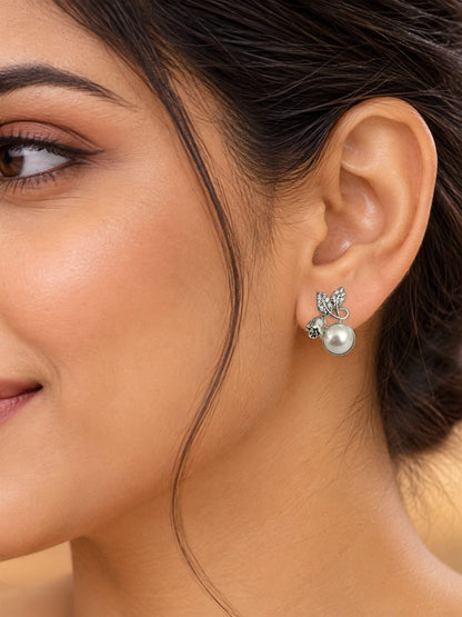 White Pearl-Effect Leaf Stud Earrings, silver plated, model close-up