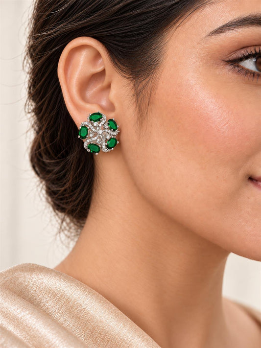 Green five-stone floral halo silver-plated stud earrings worn by a model