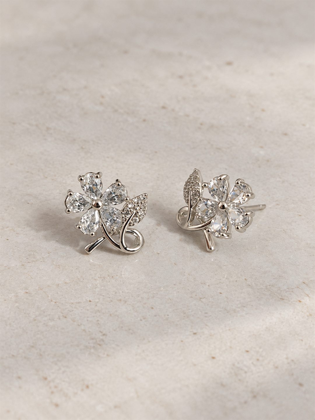 Clear Flower and Leaf Stud Earrings, silver plated, lifestyle view