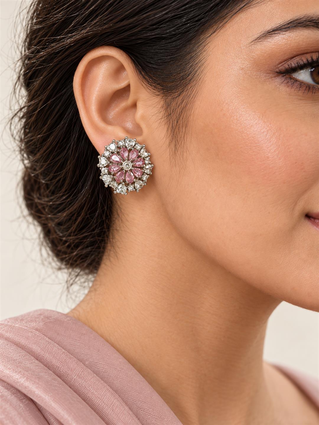 Pink heart-petal flower silver-plated stud earrings worn by a model