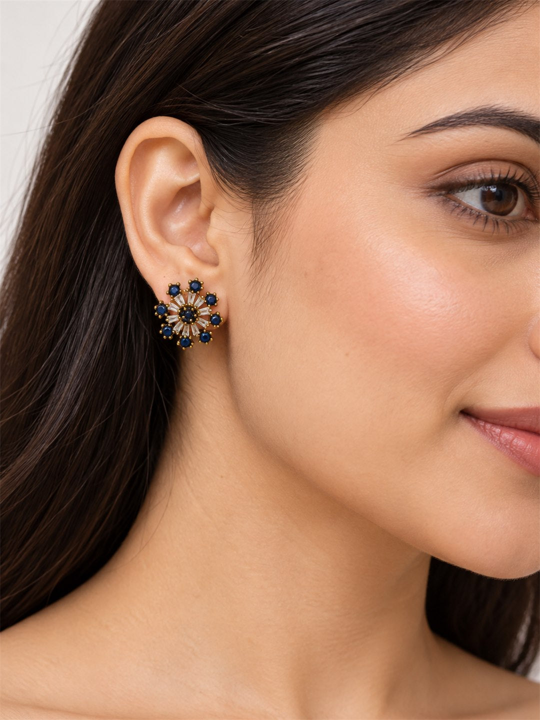 Blue Baguette Sunburst Stud Earrings, gold plated, model close-up
