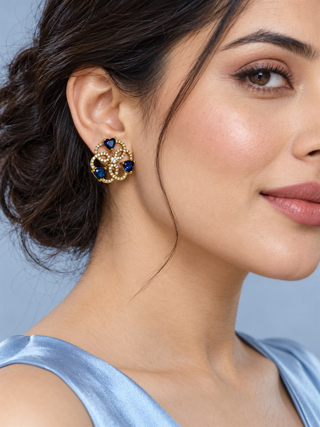 Blue Three Heart Openwork Floral Stud Earrings - Gold Plated on a model