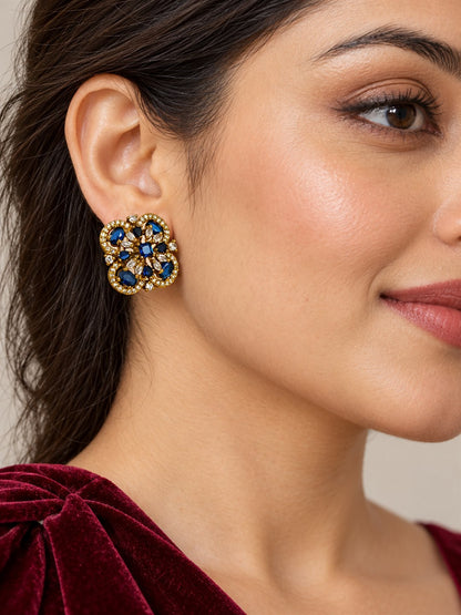 Blue Four Petal Oval Stone Stud Earrings - Gold Plated on a model