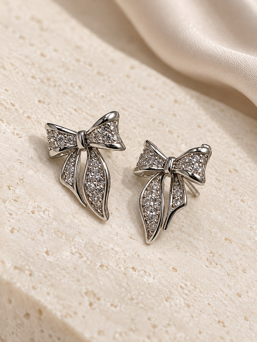 Clear Pave Bow Stud Earrings, silver plated, lifestyle view