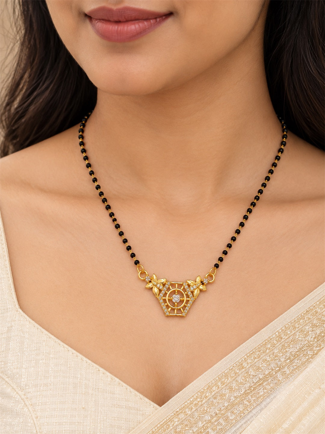 White filigree triangle gold-plated mangalsutra worn by a model