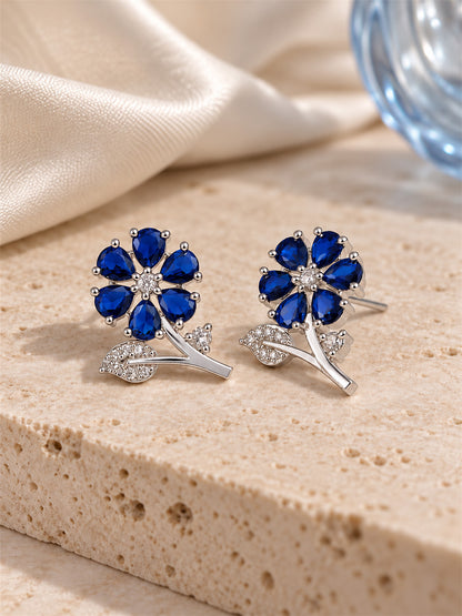 Blue Flower and Leaf Stud Earrings, silver plated, lifestyle view