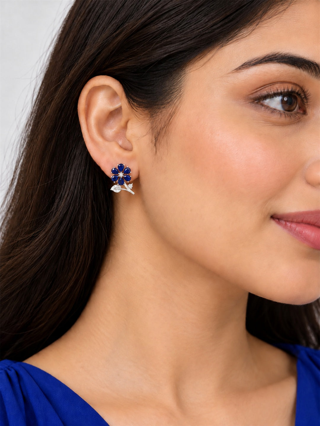 Blue Flower and Leaf Stud Earrings, silver plated, model close-up